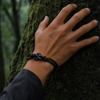 Blackened Black Mamba rope bracelet worn outdoors on the wrist